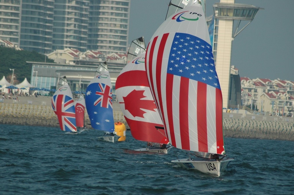 Nick Scandone and Maureen Mckinnon-Tucker on their way to winning a Gold medal in Qingdao © Lynn Fitzpatrick